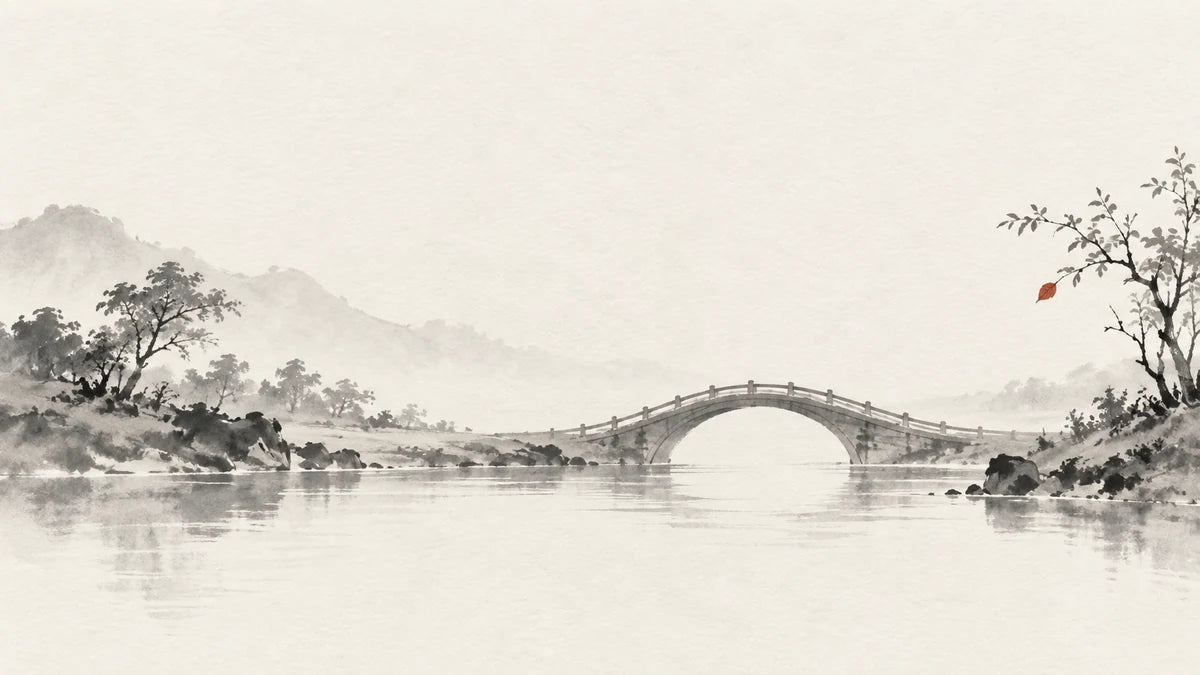 Ink wash illustration: a single ink-wash bridge between two low riverbanks, one tiny muted cinnabar leaf