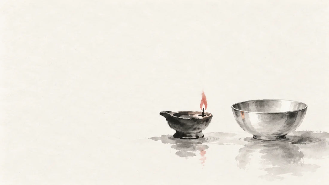 Ink wash painting of a small oil lamp beside a smooth pale metal bowl.