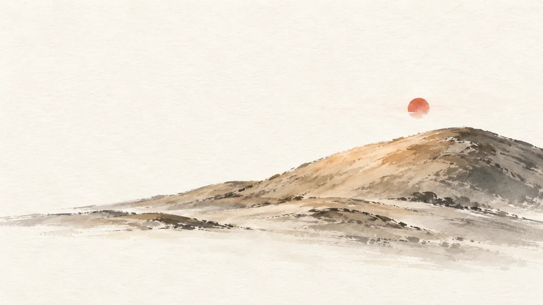 Ink wash painting of a broad earthen hill warmed by a small cinnabar sun.