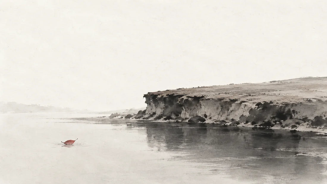 Ink wash painting of a broad earthen riverbank beside still dark water with one tiny red leaf.